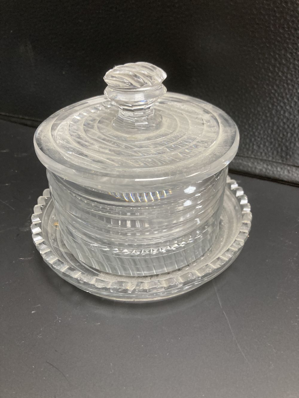 A Regency step cut glass butter dish, cover and stand and a similar celery vase, c.1810, latter 18cm